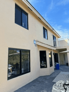 After - newly installed white-frame hurricane impact windows on Coral Springs home